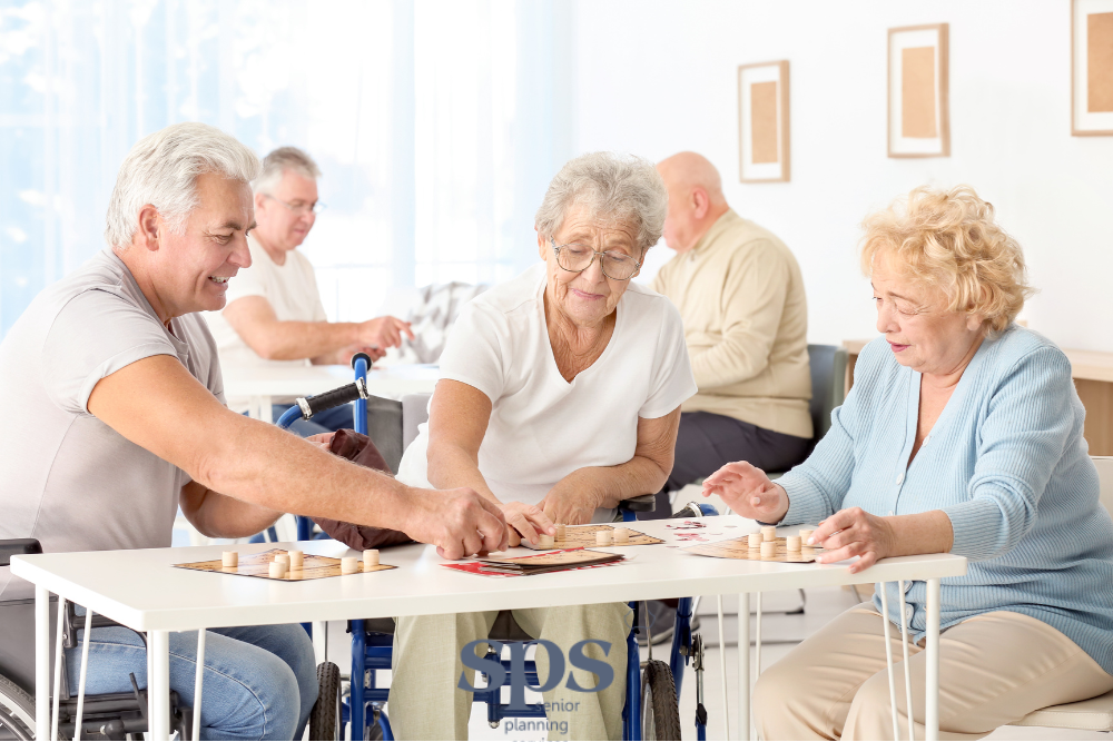 A group of seniors enjoying a lively game together at a nursing home, with Senior Planning Services supporting their care and well-being.