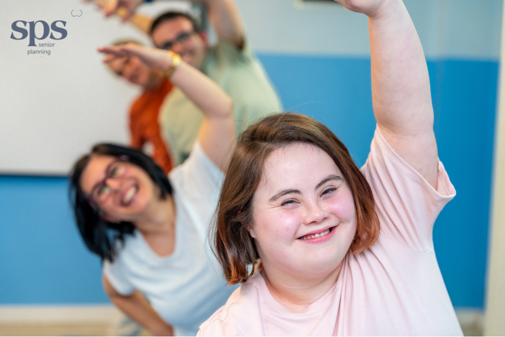 Woman with special needs doing stretches with caregivers, showing how senior planning services use special needs trusts to support wellness and protect long-term benefits.